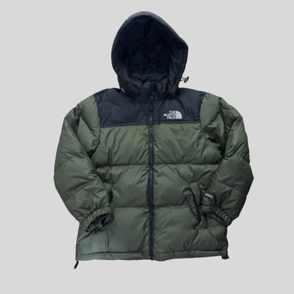 The North Face Kid green jacket suitable for winter trip